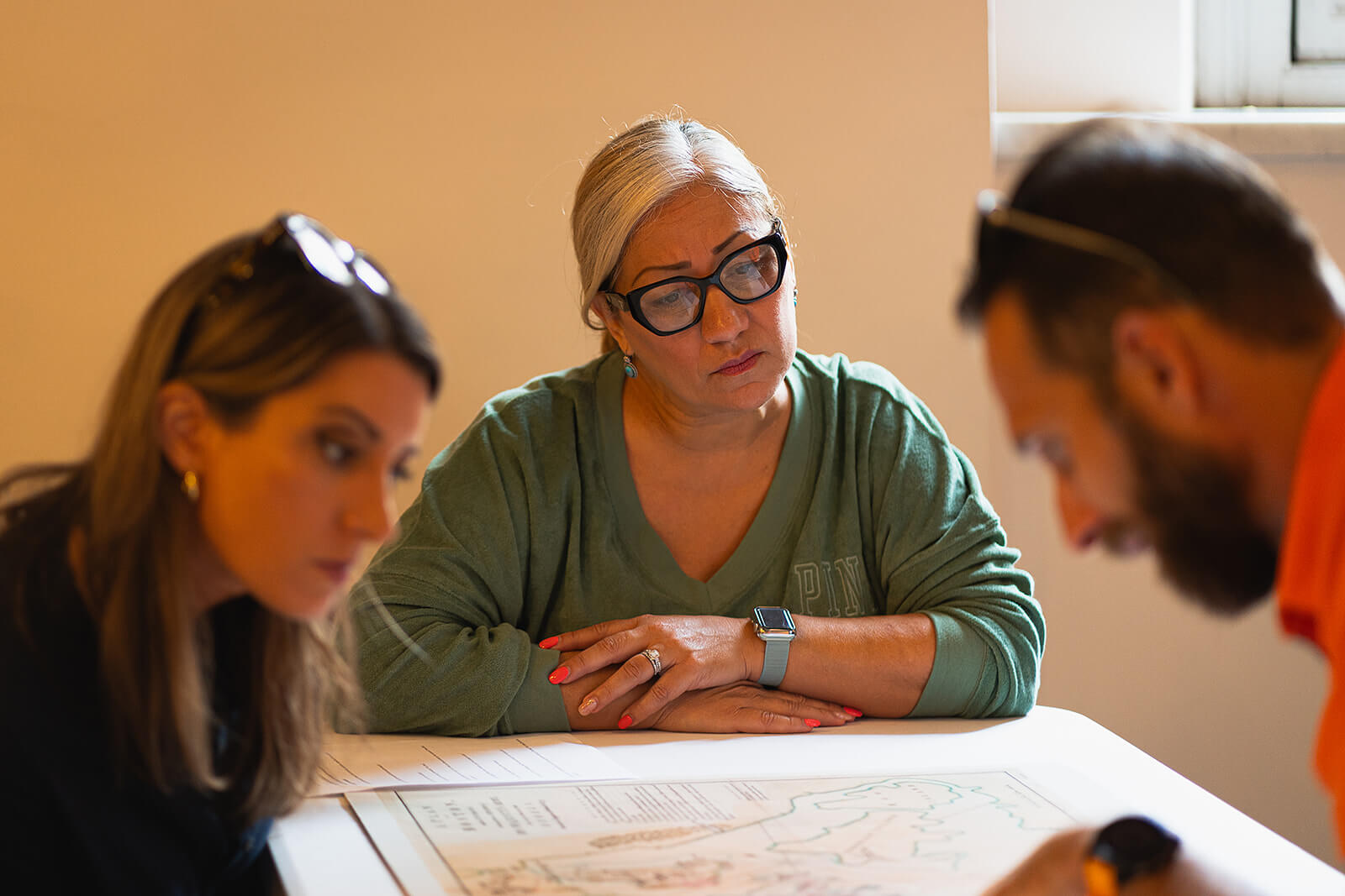 Teachers looking at a document